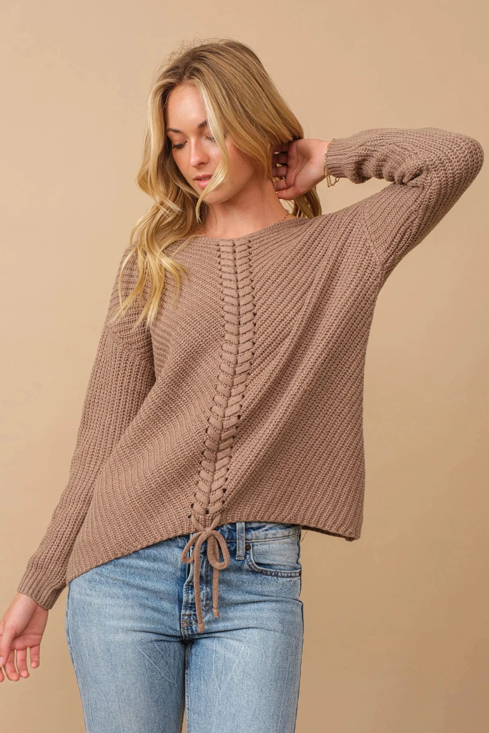 Ribbed knit round neck sweater with center lace-up detail