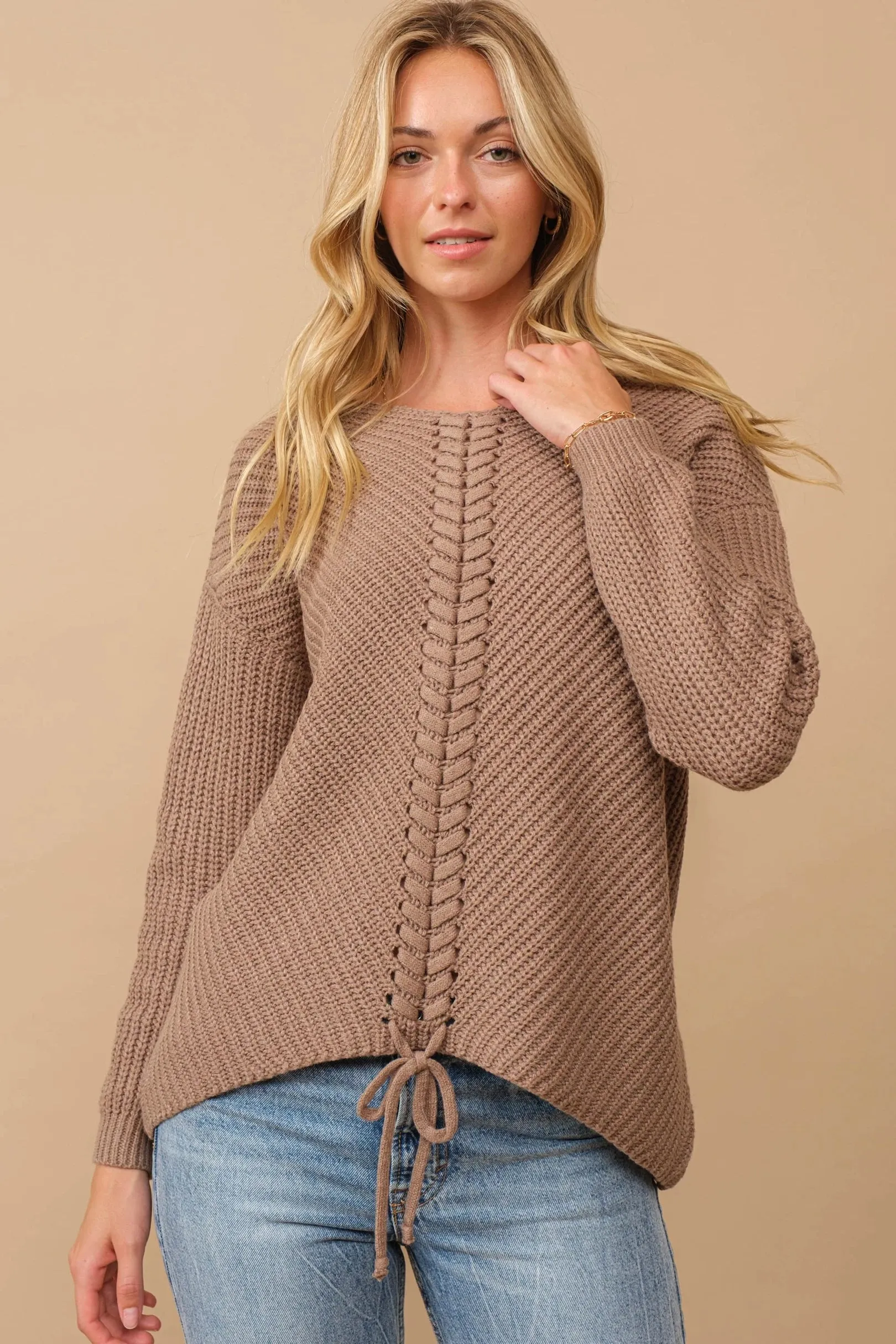 Ribbed knit round neck sweater with center lace-up detail